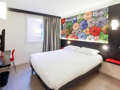 Un ou plusieurs lits dans un hébergement de l'établissement ibis Styles Flers