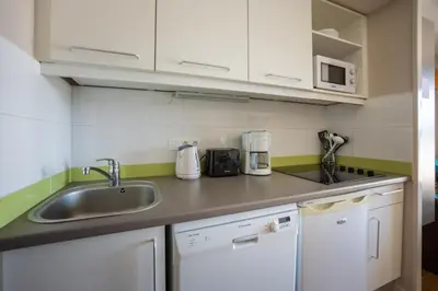 Cuisine ou kitchenette dans l'établissement Le Cormoran