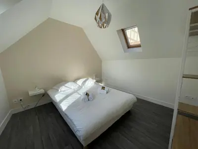 Un ou plusieurs lits dans un hébergement de l'établissement Charmante maison front de mer et centre ville