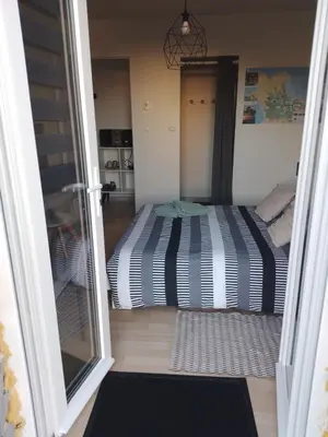 Un ou plusieurs lits dans un hébergement de l'établissement Chambre agréable au calme
