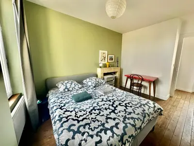 Un ou plusieurs lits dans un hébergement de l'établissement La courette, maison avec cour proche plage