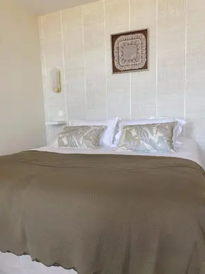 Un ou plusieurs lits dans un hébergement de l'établissement La Maison du Vieux Port