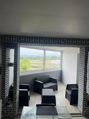 Coin salon dans l'établissement Appartement 2 pièces à Cabourg
