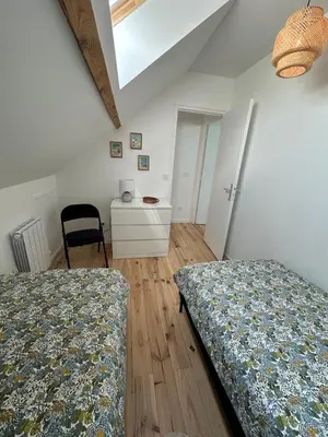 Un ou plusieurs lits dans un hébergement de l'établissement Le Clos de Baron sur Odon, un havre de paix.