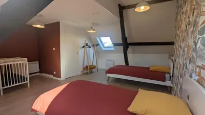 Un ou plusieurs lits dans un hébergement de l'établissement La Glycine, maison normande proche de la mer et des lieux touristiques