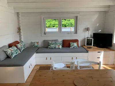 Coin salon dans l'établissement Cottage Le Cerf-volant