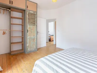 Un ou plusieurs lits dans un hébergement de l'établissement Apartment La Cancalaise by Interhome