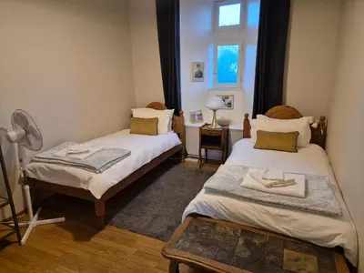 Un ou plusieurs lits dans un hébergement de l'établissement La Fiere Bridge Guest House
