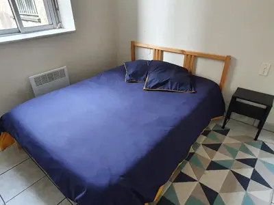 Un ou plusieurs lits dans un hébergement de l'établissement Appartement au n°1 centre d'Avranches