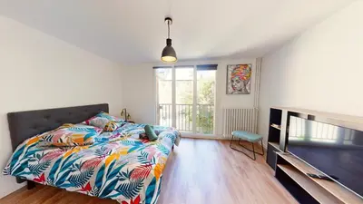Un ou plusieurs lits dans un hébergement de l'établissement Superbe appartement au cœur du centre ville
