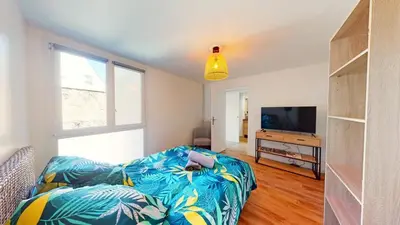 Un ou plusieurs lits dans un hébergement de l'établissement Superbe appartement au cœur du centre ville