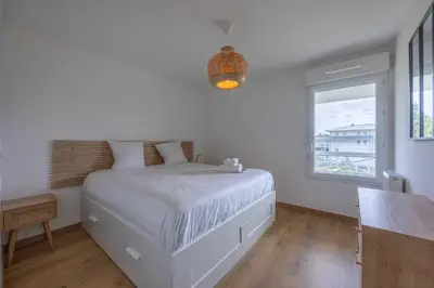 Un ou plusieurs lits dans un hébergement de l'établissement Superbe appartement neuf avec un grand balcon - Cabourg - Welkeys