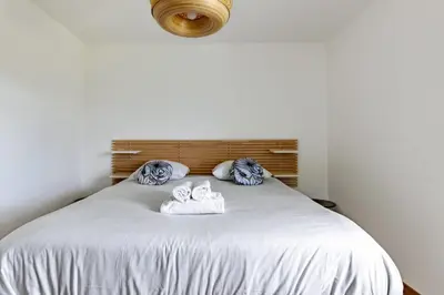 Un ou plusieurs lits dans un hébergement de l'établissement Superbe appartement neuf avec un grand balcon - Cabourg - Welkeys