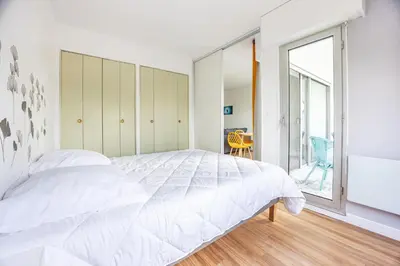 Un ou plusieurs lits dans un hébergement de l'établissement La Tortue Joyeuse - Appartement avec Loggia
