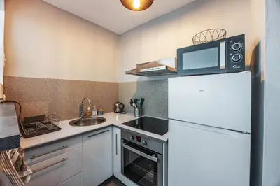 Cuisine ou kitchenette dans l'établissement La Tortue Joyeuse - Appartement avec Loggia