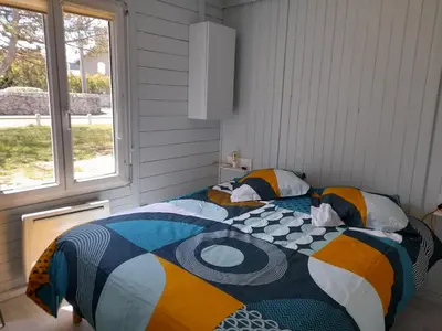Un ou plusieurs lits dans un hébergement de l'établissement Maison les pieds dans la mer