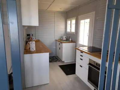 Cuisine ou kitchenette dans l'établissement Maison les pieds dans la mer