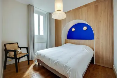 Un ou plusieurs lits dans un hébergement de l'établissement Villa Les Hirondelles - Appartement avec Jardin Front de mer