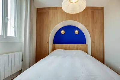 Un ou plusieurs lits dans un hébergement de l'établissement Villa Les Hirondelles - Appartement avec Jardin Front de mer