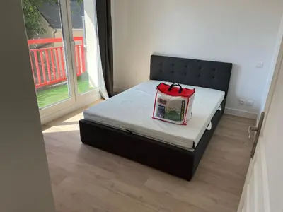 Un ou plusieurs lits dans un hébergement de l'établissement Appartement tout confort