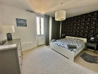 Un ou plusieurs lits dans un hébergement de l'établissement Halte Lutine - Maison chaleureuse en pierres