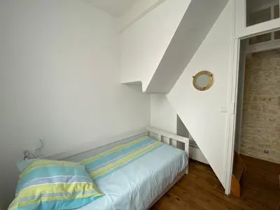 Un ou plusieurs lits dans un hébergement de l'établissement La Maison Bleue
