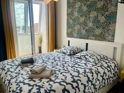 Un ou plusieurs lits dans un hébergement de l'établissement Appt centre de Courseulles - 100m de la plage