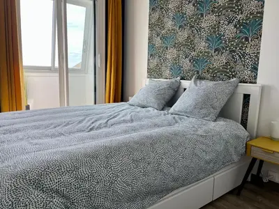 Un ou plusieurs lits dans un hébergement de l'établissement Appt centre de Courseulles - 100m de la plage