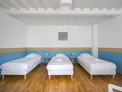 Un ou plusieurs lits dans un hébergement de l'établissement Normandy Garden Escape