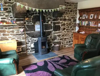 Coin salon dans l'établissement Ferme de Noyes Cottage