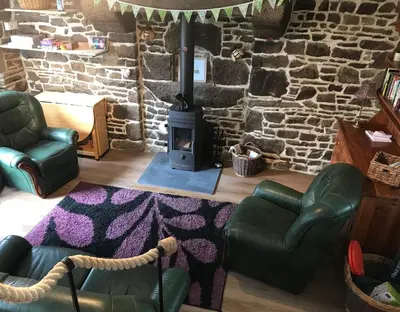 Coin salon dans l'établissement Ferme de Noyes Cottage