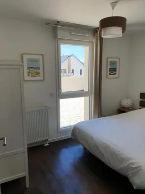 Un ou plusieurs lits dans un hébergement de l'établissement Othello Sea Flat - Appartement terasse familial