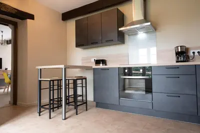 Cuisine ou kitchenette dans l'établissement Le champ bourdon