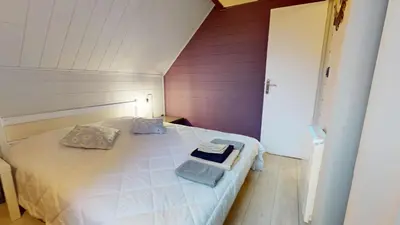 Un ou plusieurs lits dans un hébergement de l'établissement Le chalet Normand