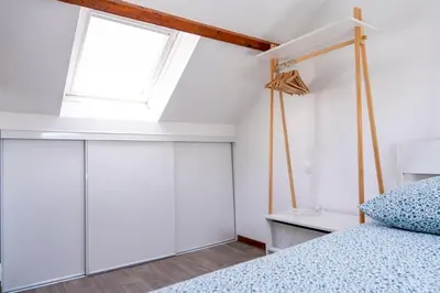 Un ou plusieurs lits dans un hébergement de l'établissement Grand appartement spacieux sur les toits de Bayeux