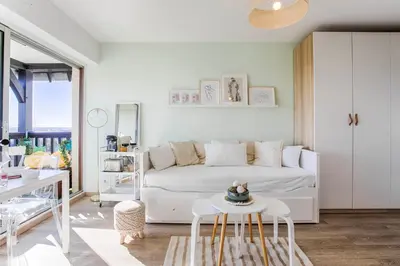 Coin salon dans l'établissement Appartement cosy avec vue imprenable sur Cabourg - accès direct plage - proche centre ville