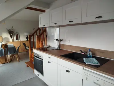 Cuisine ou kitchenette dans l'établissement DUPLEX les pieds dans l' eau