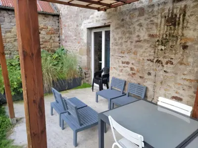 Coin salon dans l'établissement Baie du mont saint michel - 6 personnes - Spa privatif