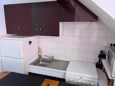 Cuisine ou kitchenette dans l'établissement 0 rdc Appartement centre flers proche commerces et gare