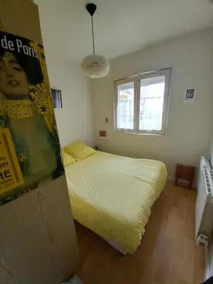 Un ou plusieurs lits dans un hébergement de l'établissement Appartement charmant avec vue sur la mer à Cabourg - 30 m²