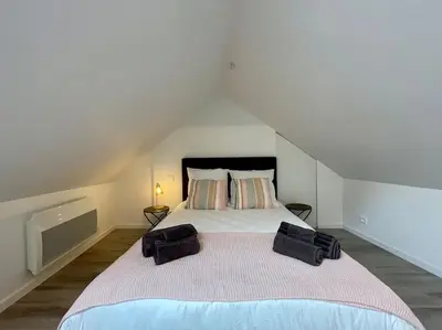 Un ou plusieurs lits dans un hébergement de l'établissement Le logis BAYA - WEEKEND & HOLIDAY - WIFI & TV
