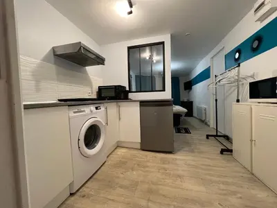 Cuisine ou kitchenette dans l'établissement La Pause - studio en ville