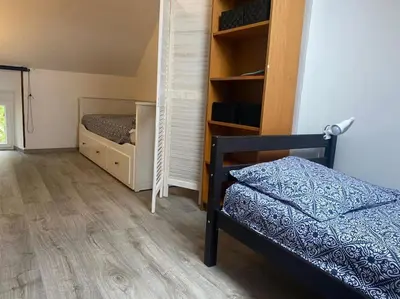 Un ou plusieurs lits dans un hébergement de l'établissement Gîte Les Aubins - Bord de Mer - Cotentin