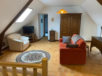 Télévision ou salle de divertissement dans l'établissement Gîte Les Aubins - Bord de Mer - Cotentin