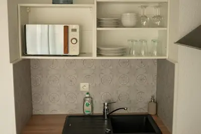Cuisine ou kitchenette dans l'établissement Studio Ouistreham entre centre-ville et plages