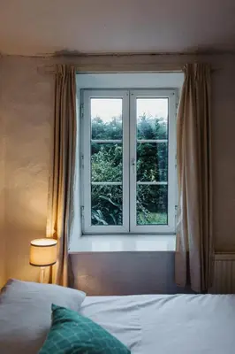 Un ou plusieurs lits dans un hébergement de l'établissement La Bergerie Chaleureux Cottage en Bord de Mer