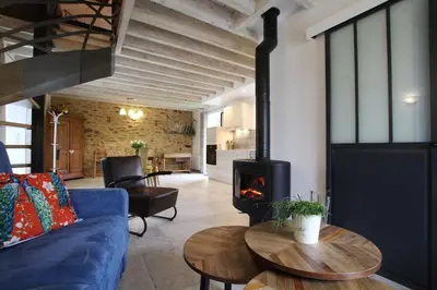 Coin salon dans l'établissement Gîte Au fil de l'eau