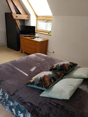 Un ou plusieurs lits dans un hébergement de l'établissement Joli Appartement avec vue sur la Baie