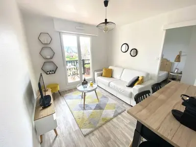 Coin salon dans l'établissement Cabourg T2 tout neuf Accès direct mer Grand balcon