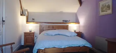 Un ou plusieurs lits dans un hébergement de l'établissement Le Fry Holiday Gite